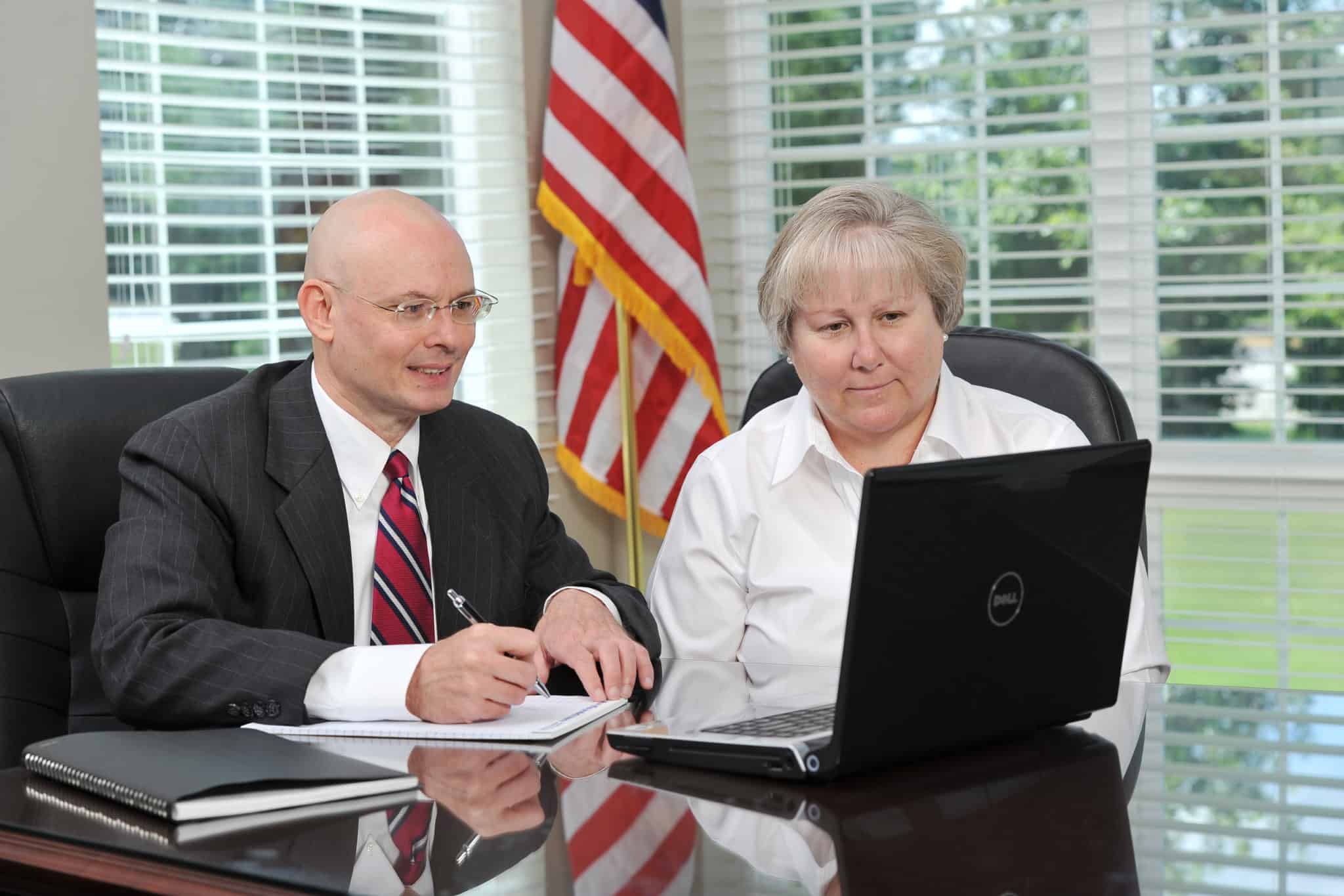 tom dunn and woman on computer together