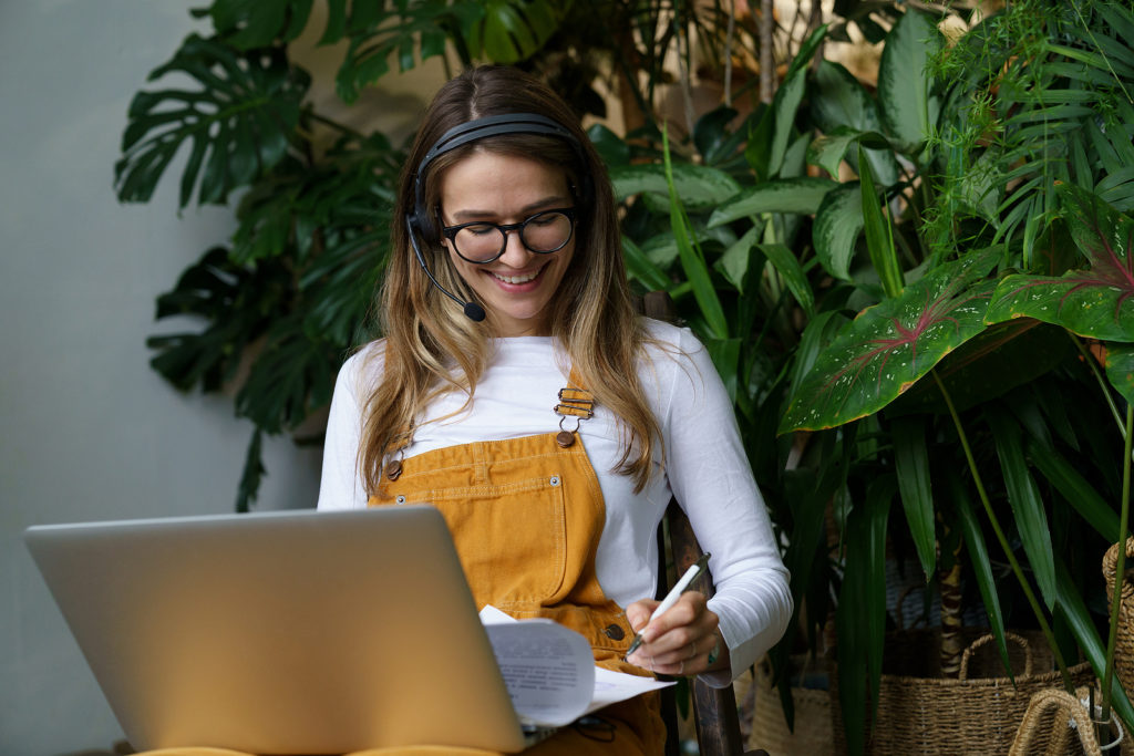 why become an entrepreneur girl in yellow overalls on laptop